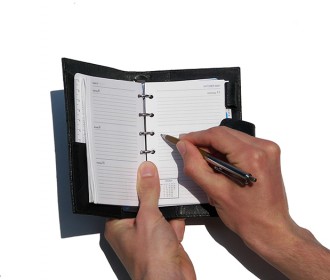 hand writing in a day planner
