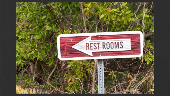Rest Rooms Sign with Arrow