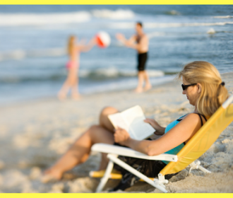 Woman in beach chair reading