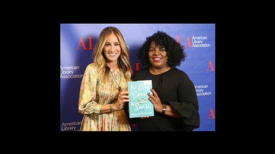 Sarah Jessica Parker and Stephanie Powell Watts holding a copy of Watts' book