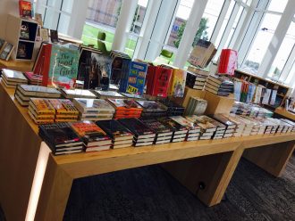 photo of book table with books neatly stacked