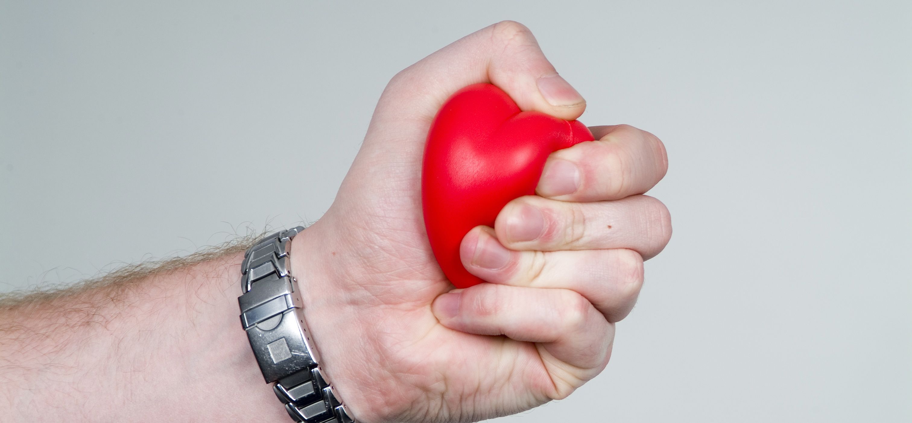 hand squeezing red stress ball