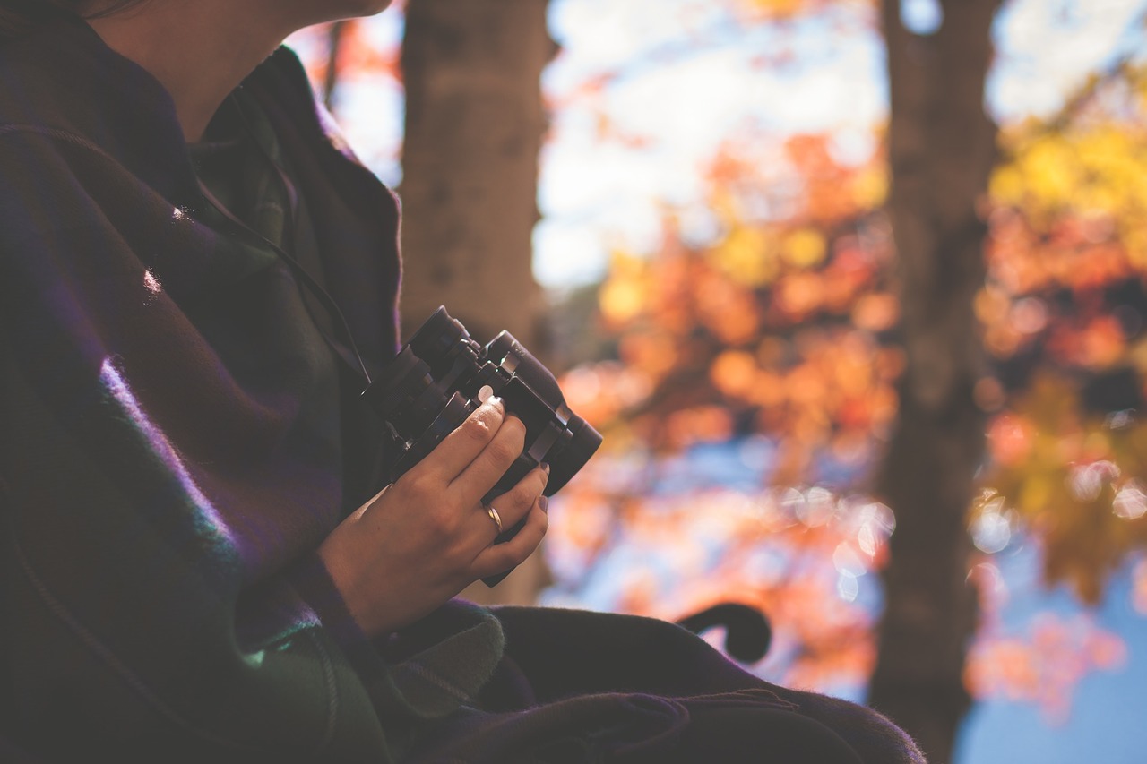 woman holding binoculars