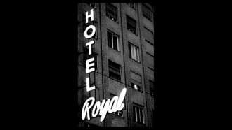 black and white image of hotel sign