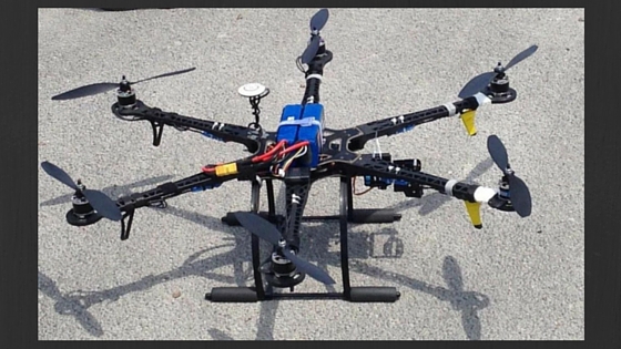 picture of a drone on a cement sidewalk
