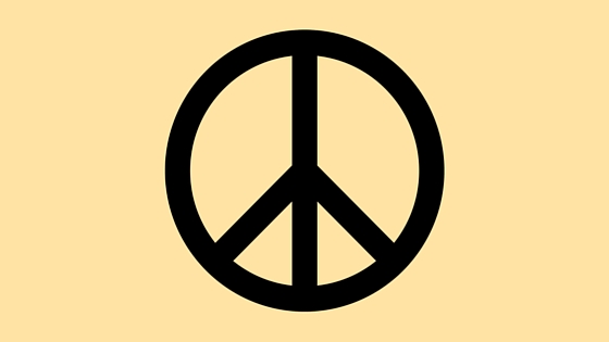 black peace sign on yellow background