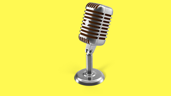 silver microphone on yellow background