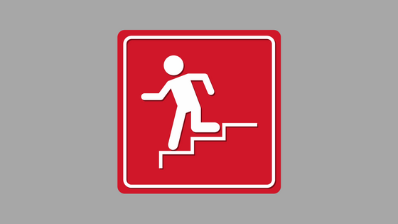 image of emergency route red back ground white stick figure running down stairs