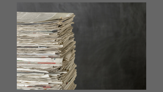 photograph of a stack of newspapers