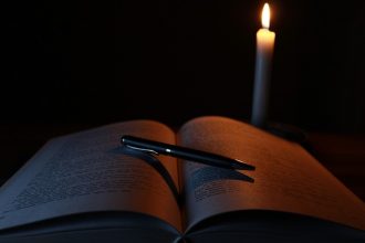 spooky book and candle