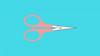 scissors with pink handle on blue background