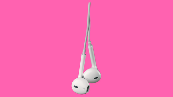 white ear buds on pink background