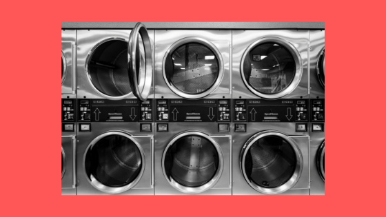 a wall of dryers at a laundromat