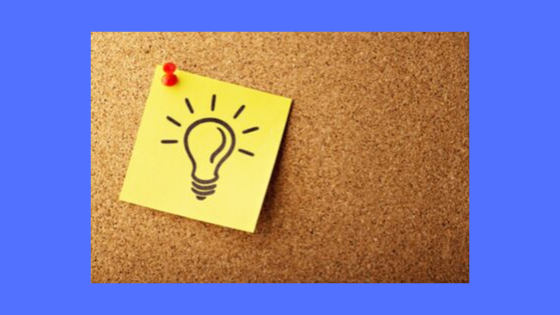 Post it note feature a light bulb (signifying bright idea) tacked to a bulletin board