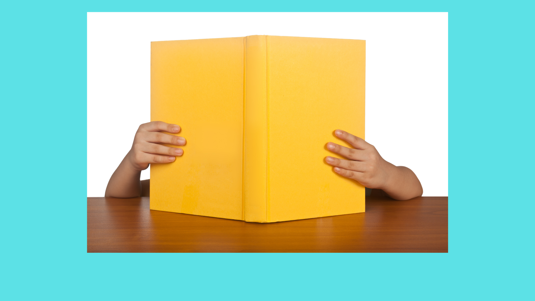 a child's arms holding/reading a yellow book