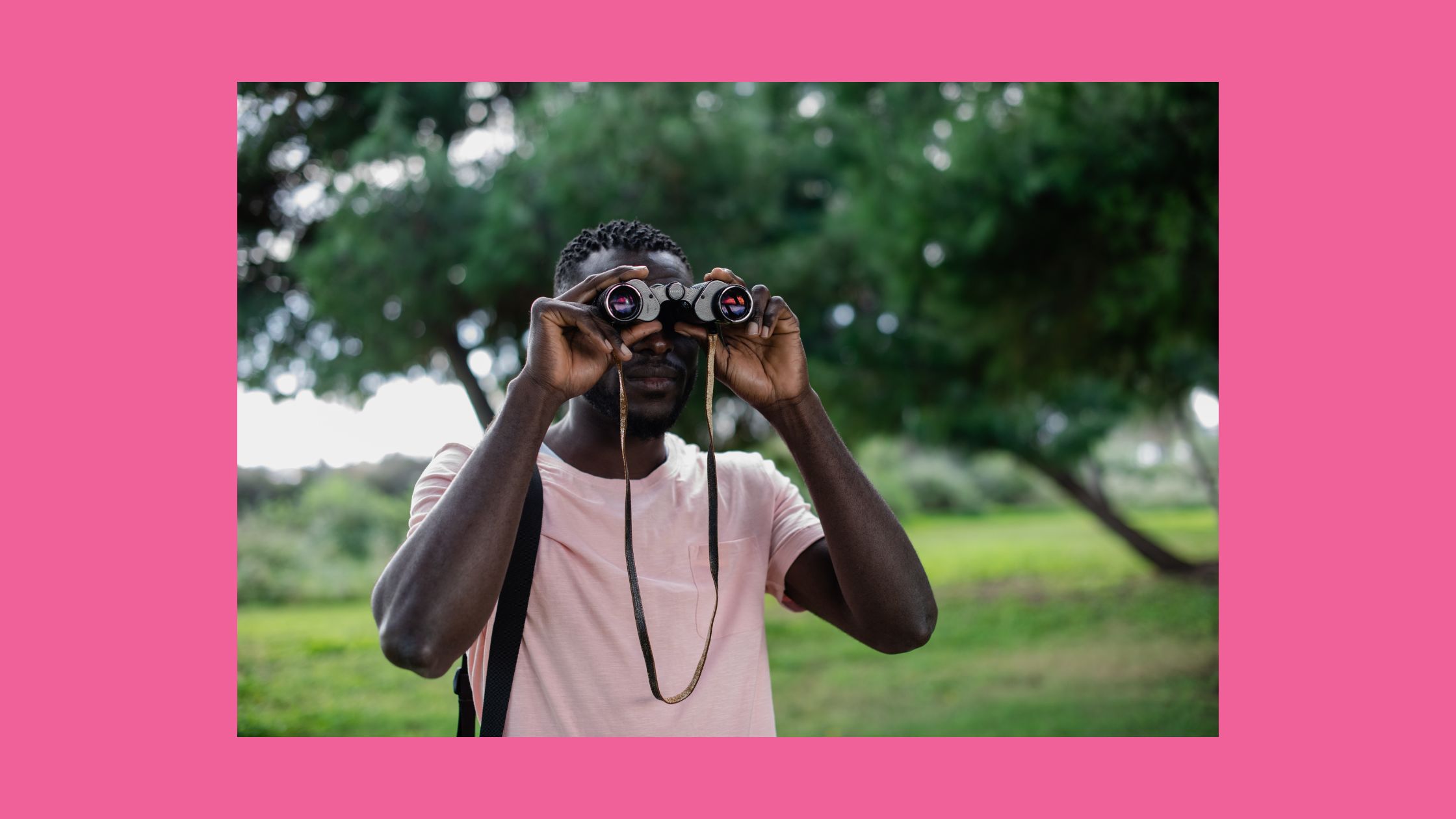 person looking through binoculars