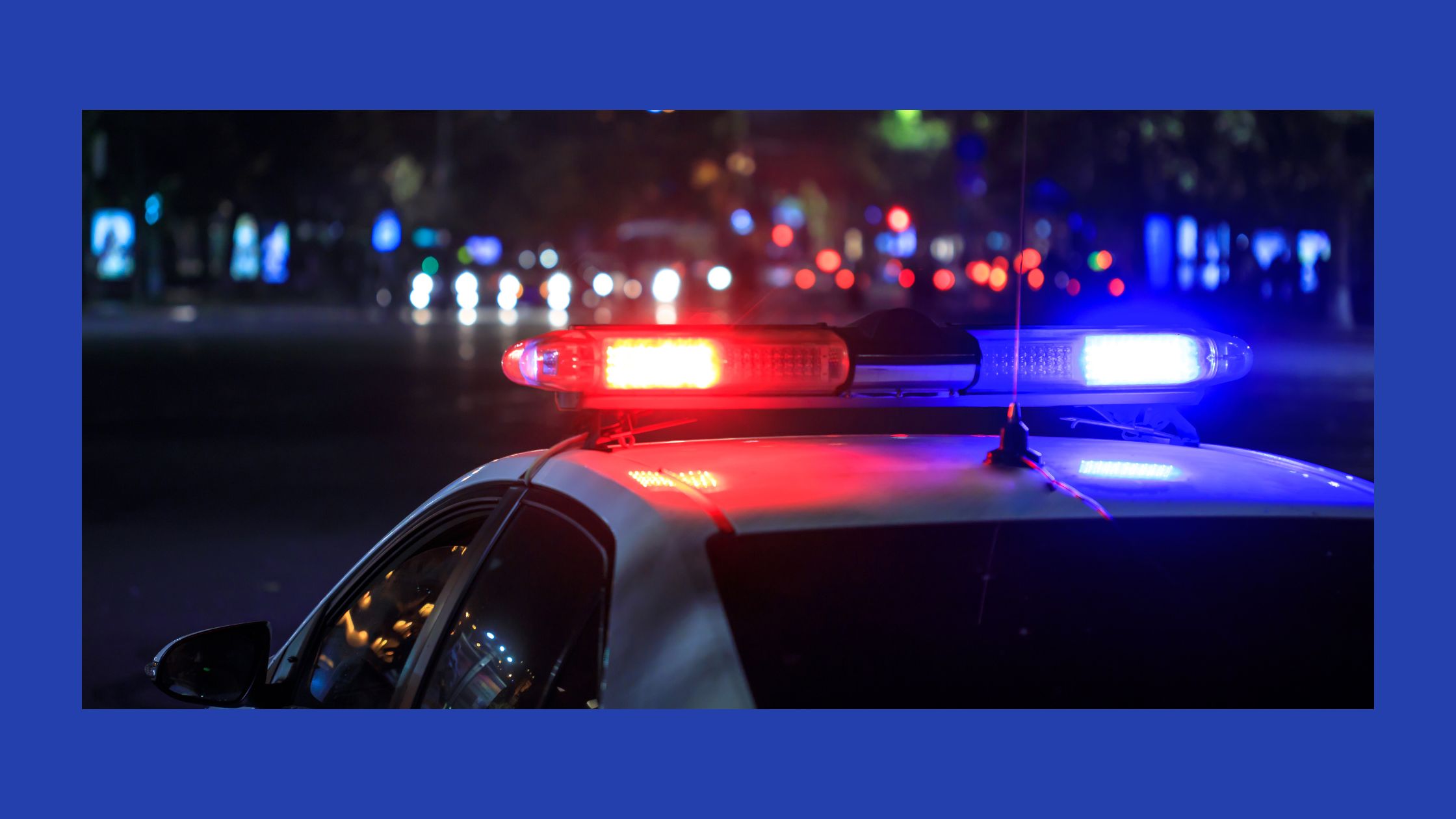 red and blue police lights in a night background