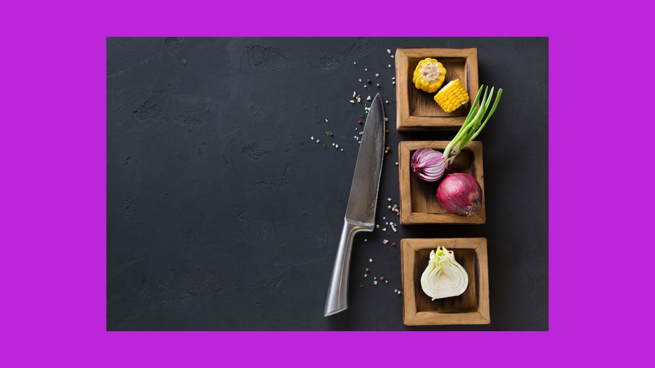cutting board with knife and vegetables