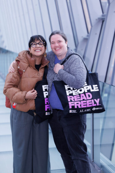 Photograph of two women carrying Free People Read Freely Tote Bags