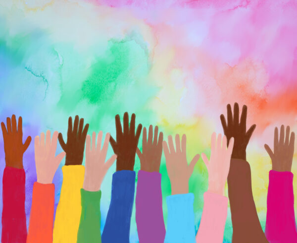 hands of different skin tones reach for a rainbow-hued sky