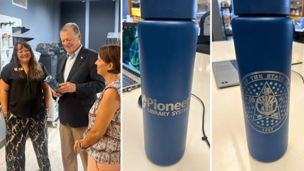A photo of 2 people presenting another person with a blue tumbler cup, next to 2 photos of the logos engraved on the tumbler cup. The Noble Public Library Branch staff present Rep. Tom Cole with his own tumbler cup, laser-engraved in the Maker Lab with the PLS logo and the Oklahoma State Seal.