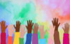 multi racial hands reaching into a rainbow colored sky